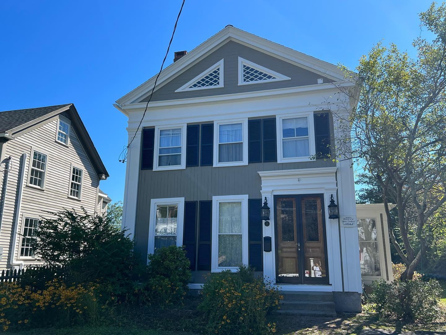 Restored residential exterior painting project in Mystic